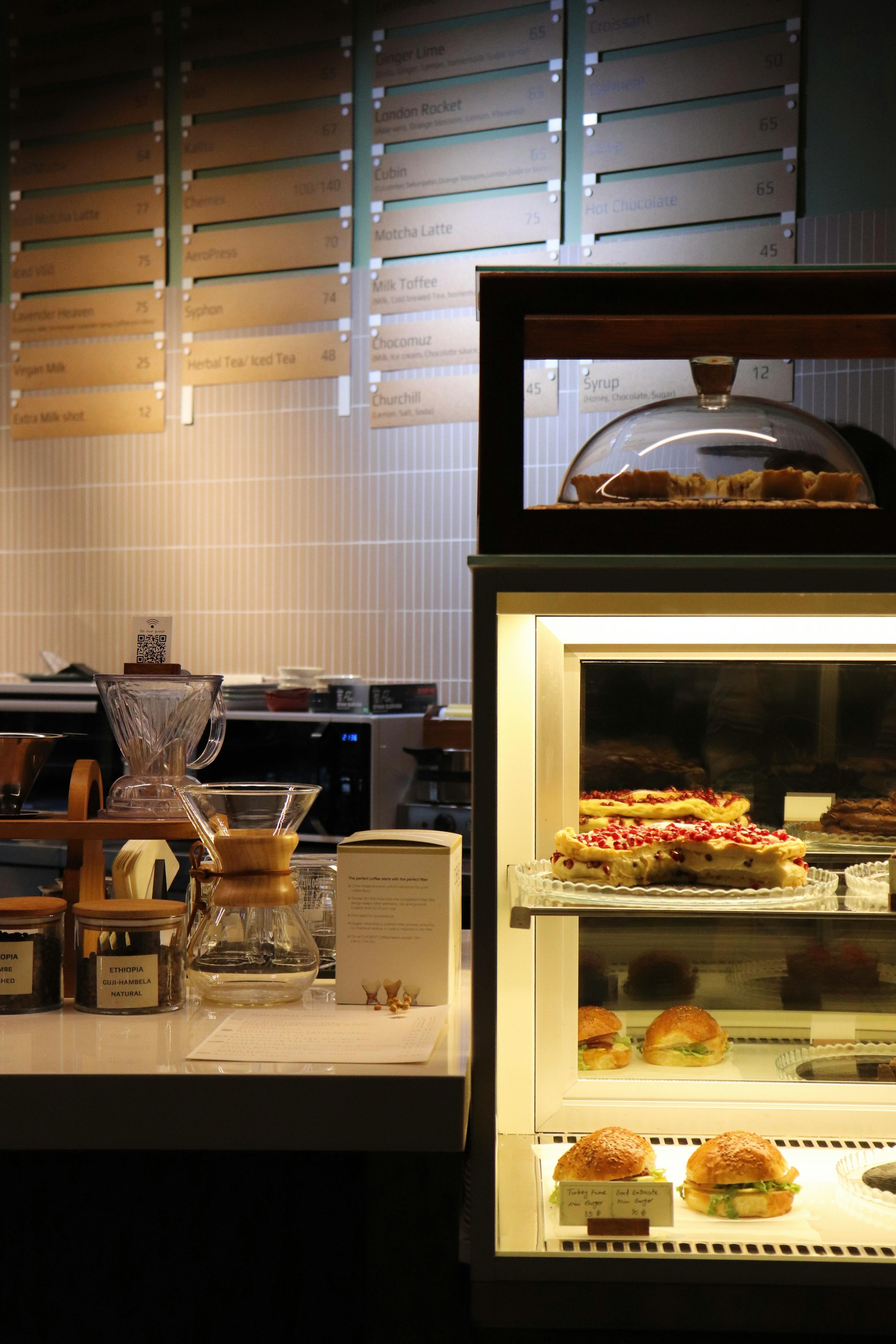 a display case with pastries and breads in it