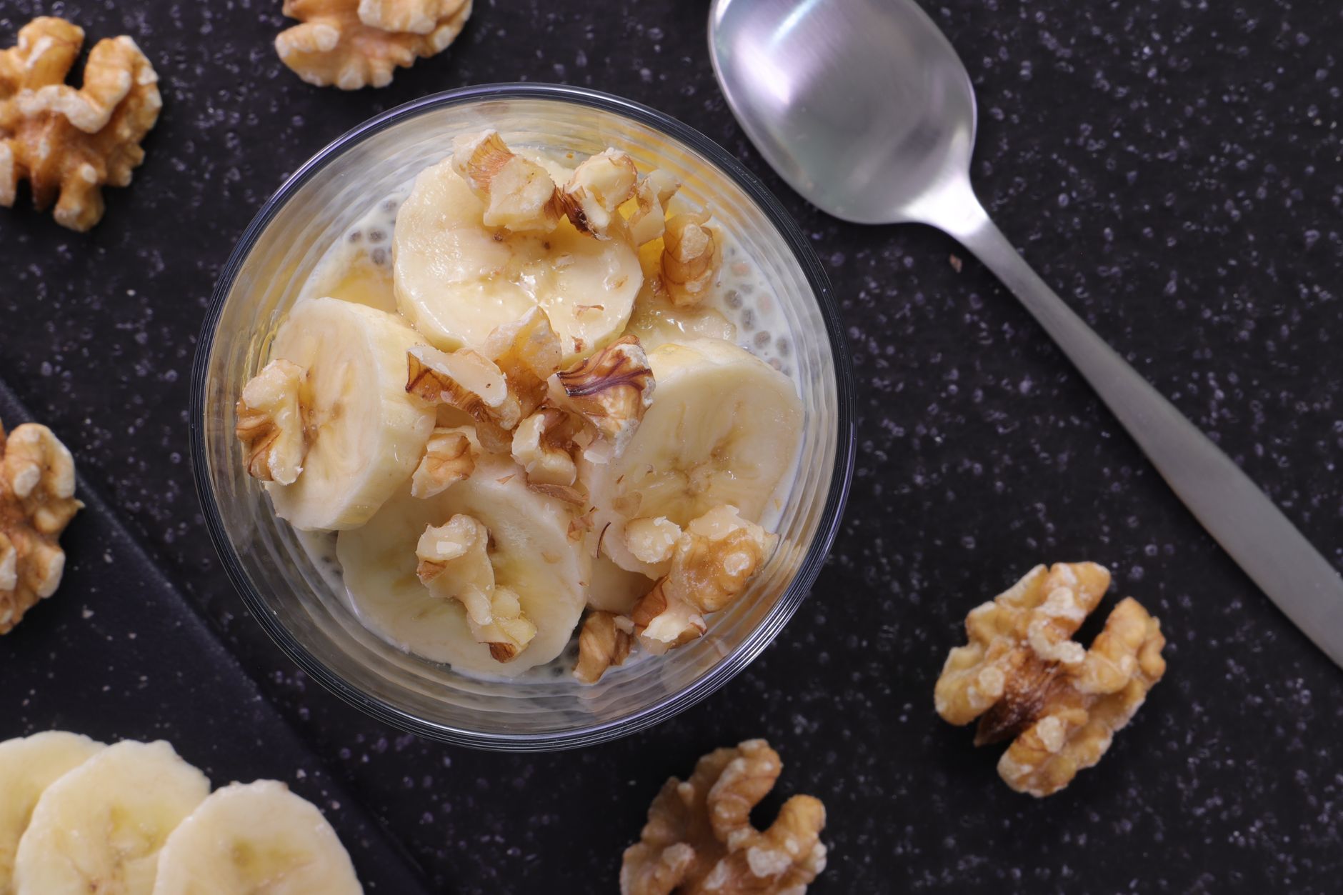 Close-up of golden banana nut muffin bread pudding topped with banana chips