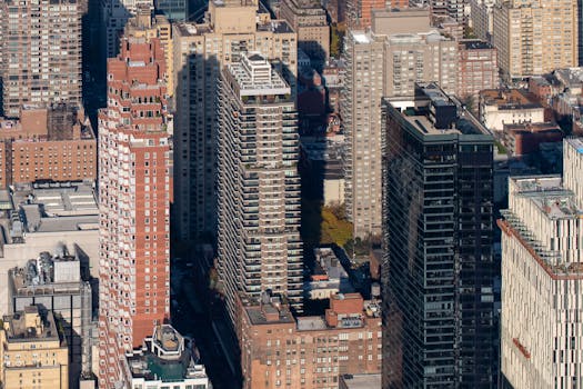 A detailed aerial view showcasing the dense New York City skyline with diverse skyscrapers.