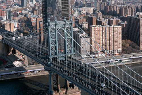 Free A stunning aerial shot of the historic Manhattan Bridge with New York City skyline in the background. Stock Photo