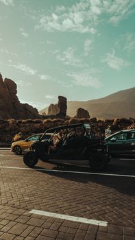 Explore the majestic desert landscape with thrilling off-road vehicles at sunset.
