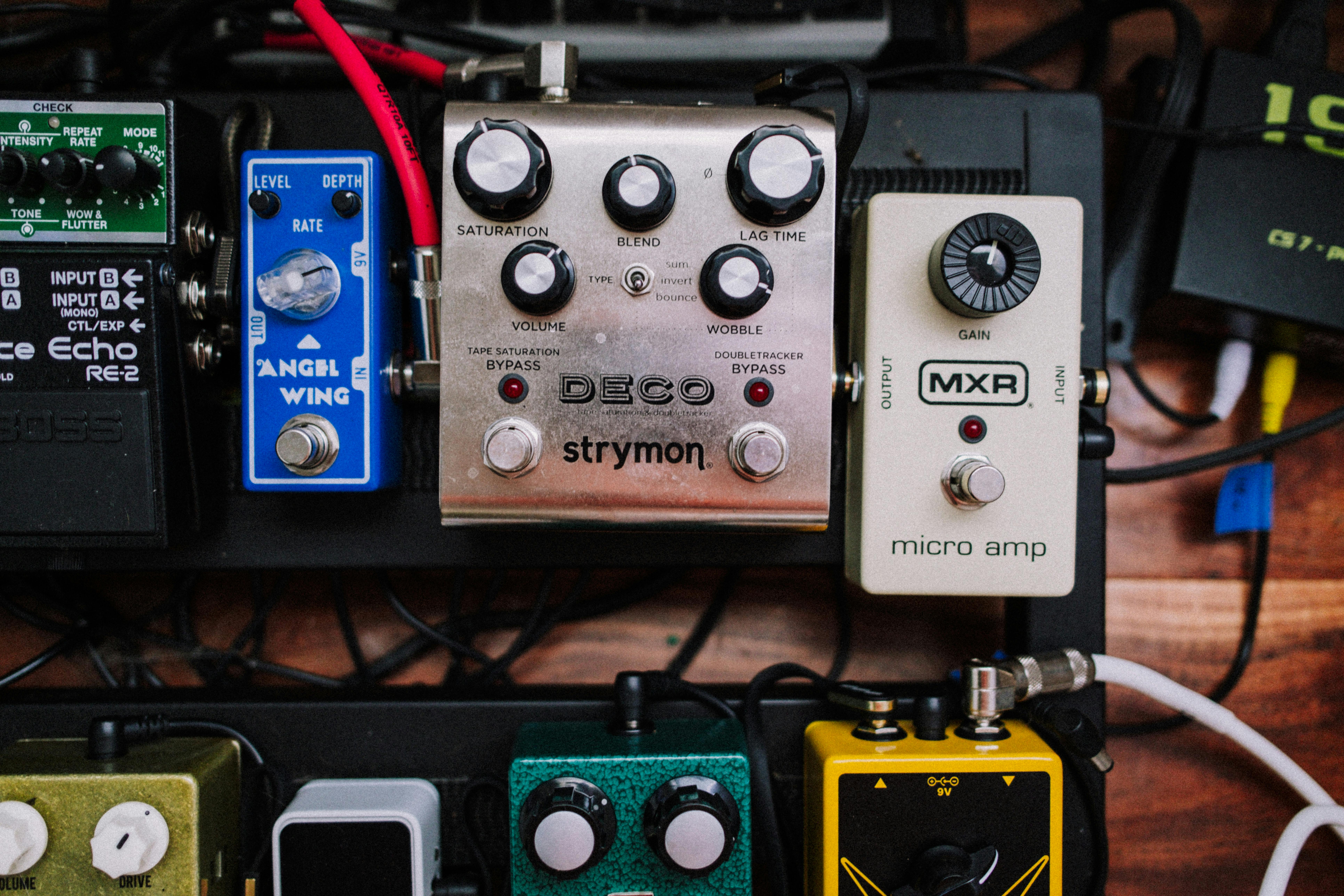 a variety of pedals and effects pedals on a table