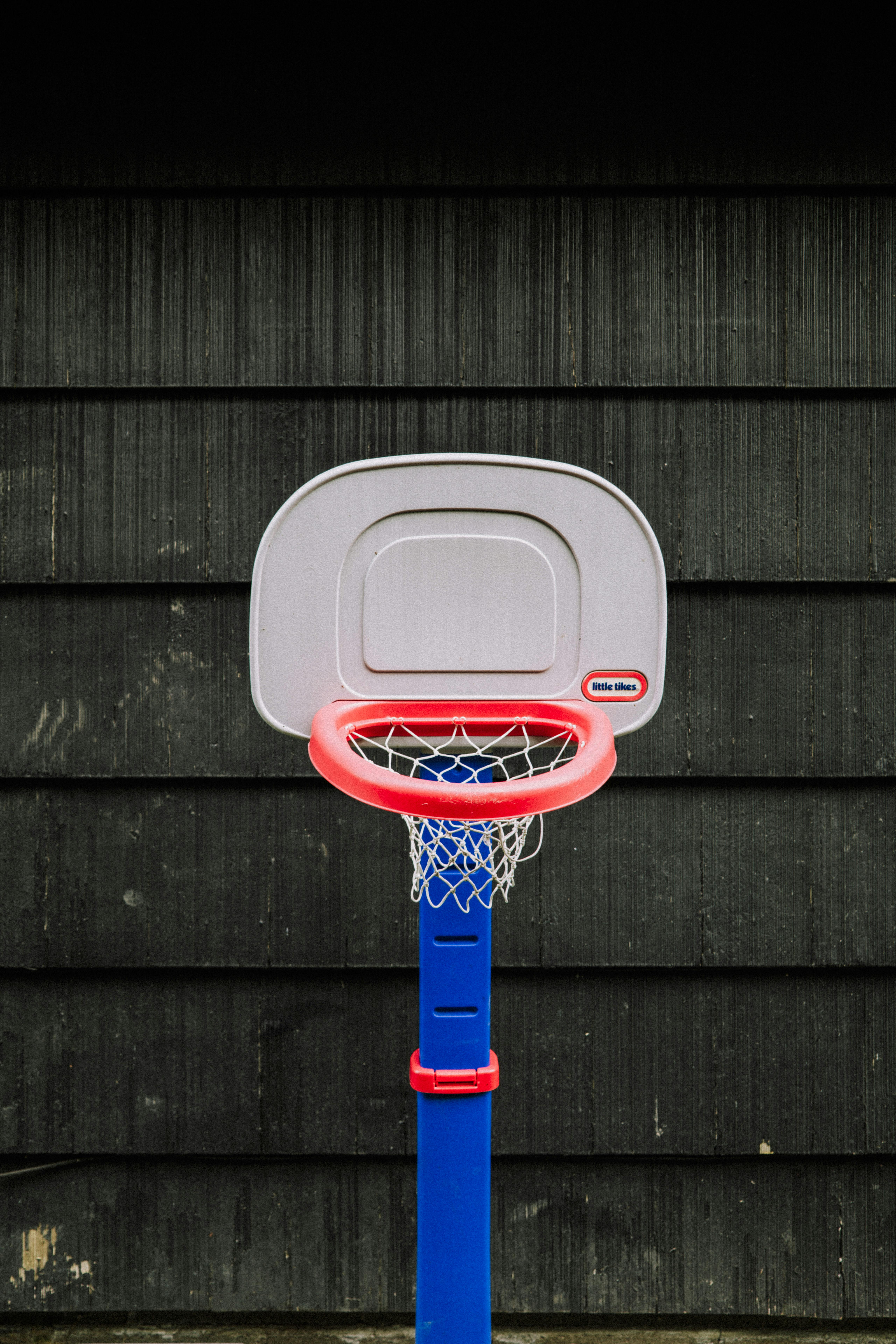 a basketball hoop with a blue and red base