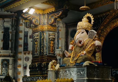 Free Intricately detailed Lord Ganesha statue in a richly decorated Indian temple, Pune, India. Stock Photo