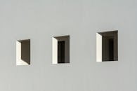 Windows in White Wall
