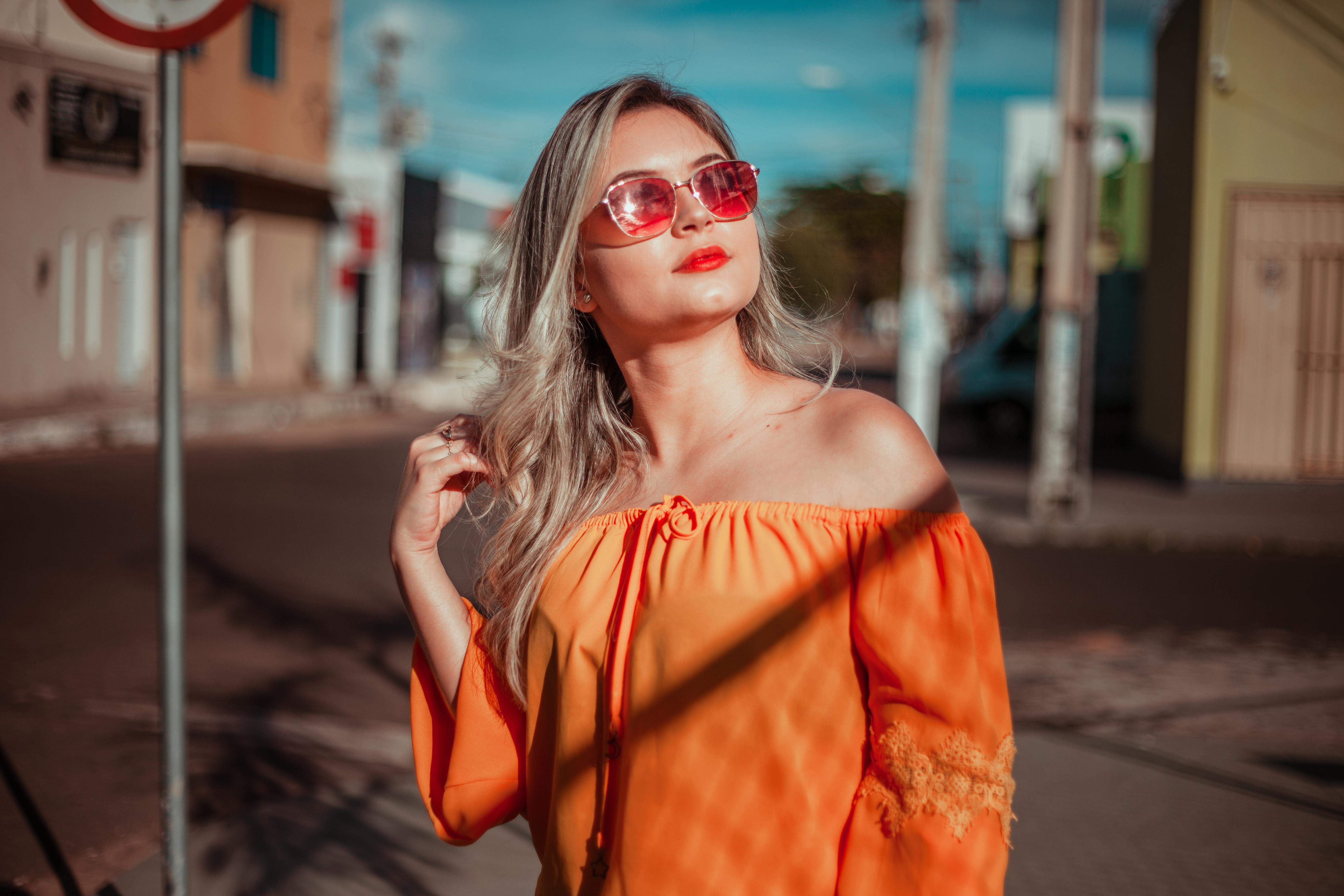 Woman In Orange Off-shoulder Blouse