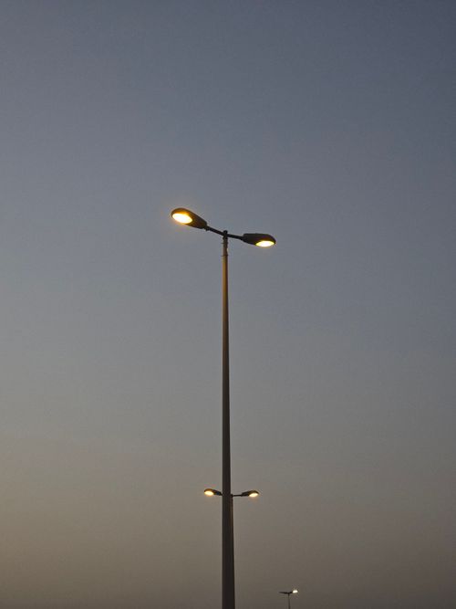 Free A streetlight illuminated against the Dubai twilight sky Stock Photo