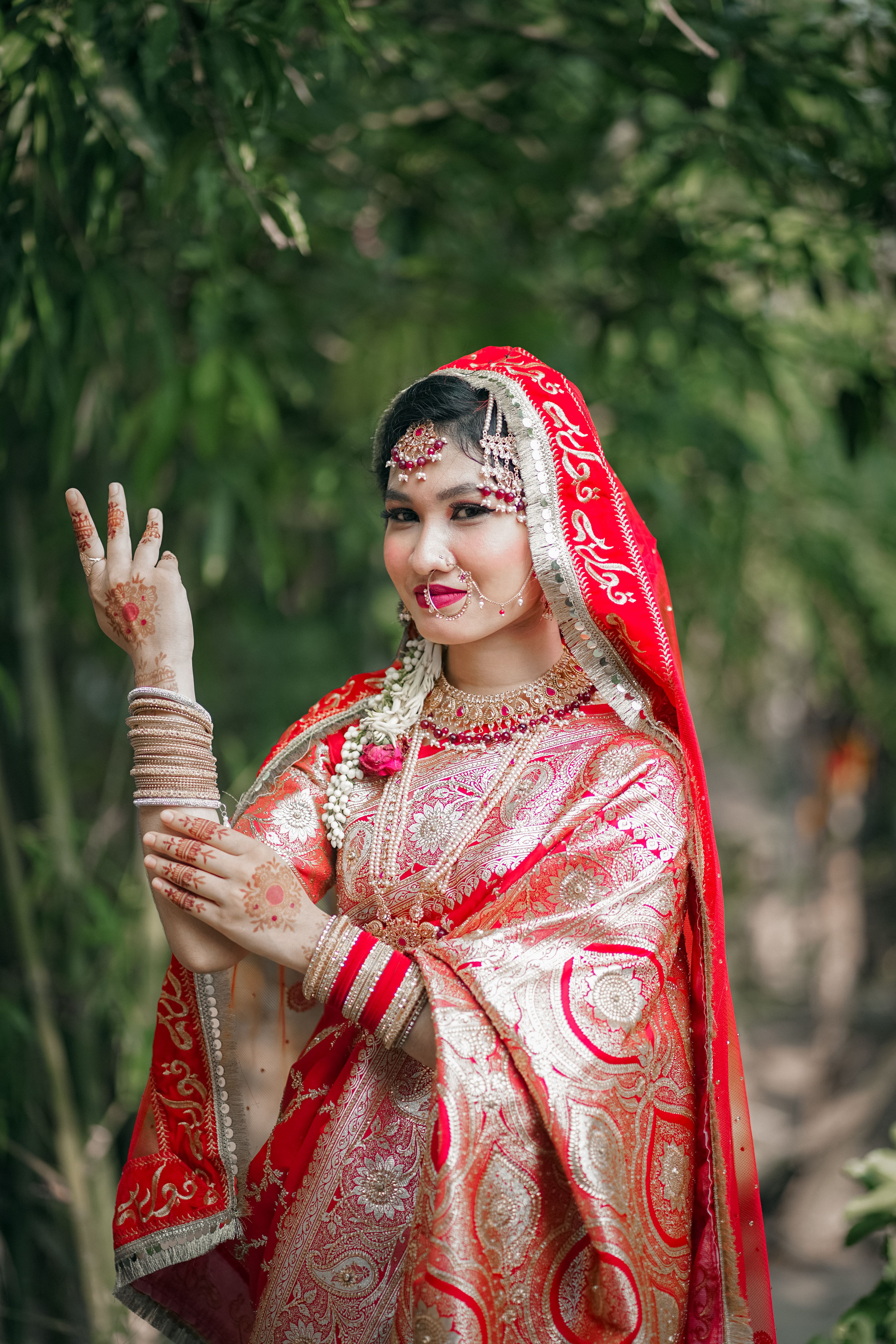 A beautiful indian bride in traditional attire · Free Stock Photo