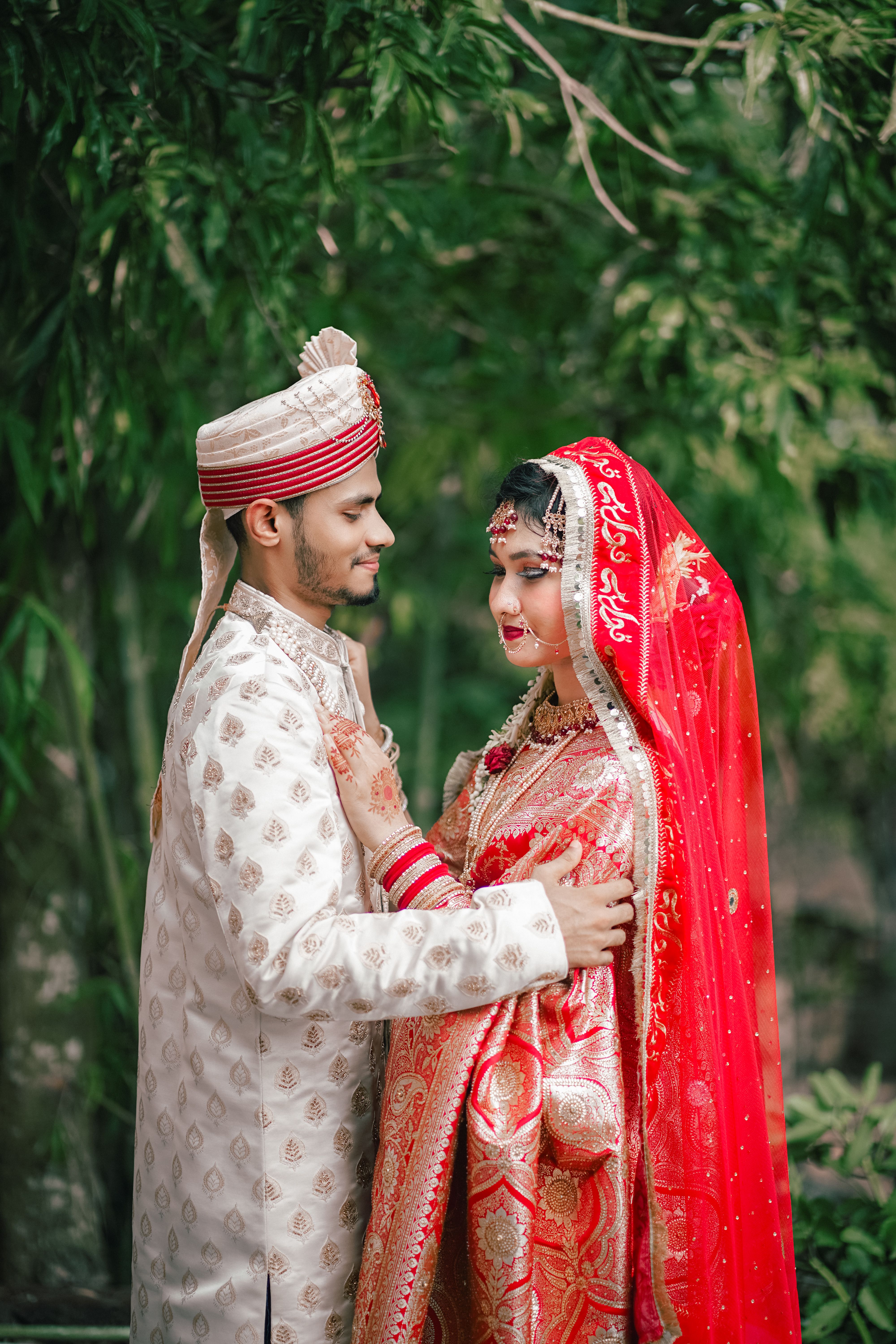 A couple in traditional indian attire posing for a photo · Free Stock Photo