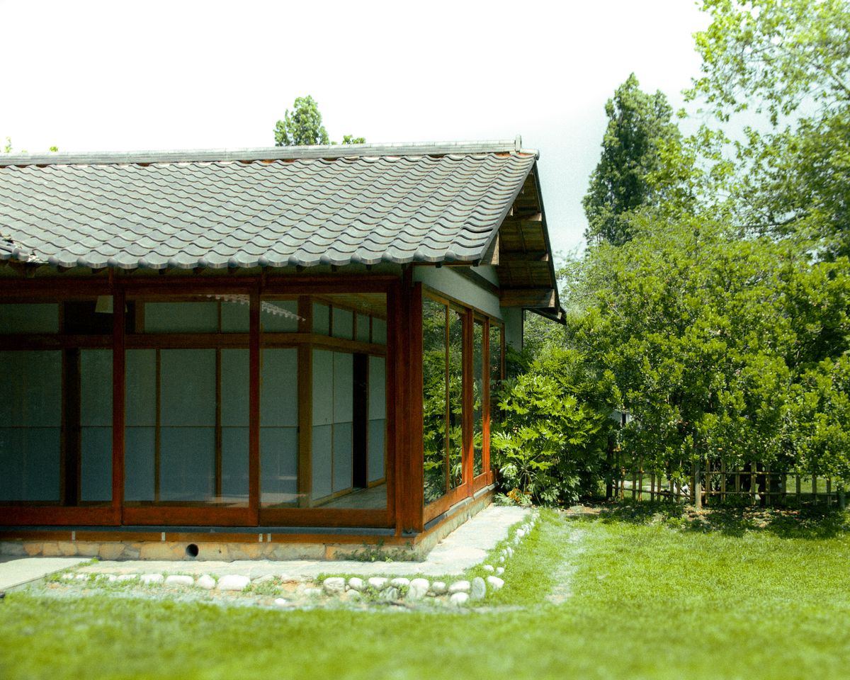 Traditional Japanese house surrounded by garden