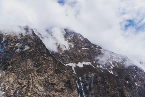 Free Dramatic view of Himalayan peak with clouds in Ghandruk, Nepal, perfect for travel and adventure themes. Stock Photo