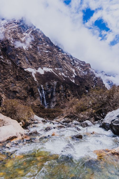 Free Majestic mountain landscape with a flowing river in Ghandruk, Nepal. Stock Photo