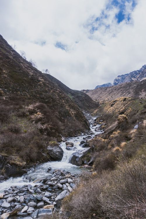 Free Beautiful river flowing through Ghandruk valley in the Himalayan mountains of Nepal. Stock Photo