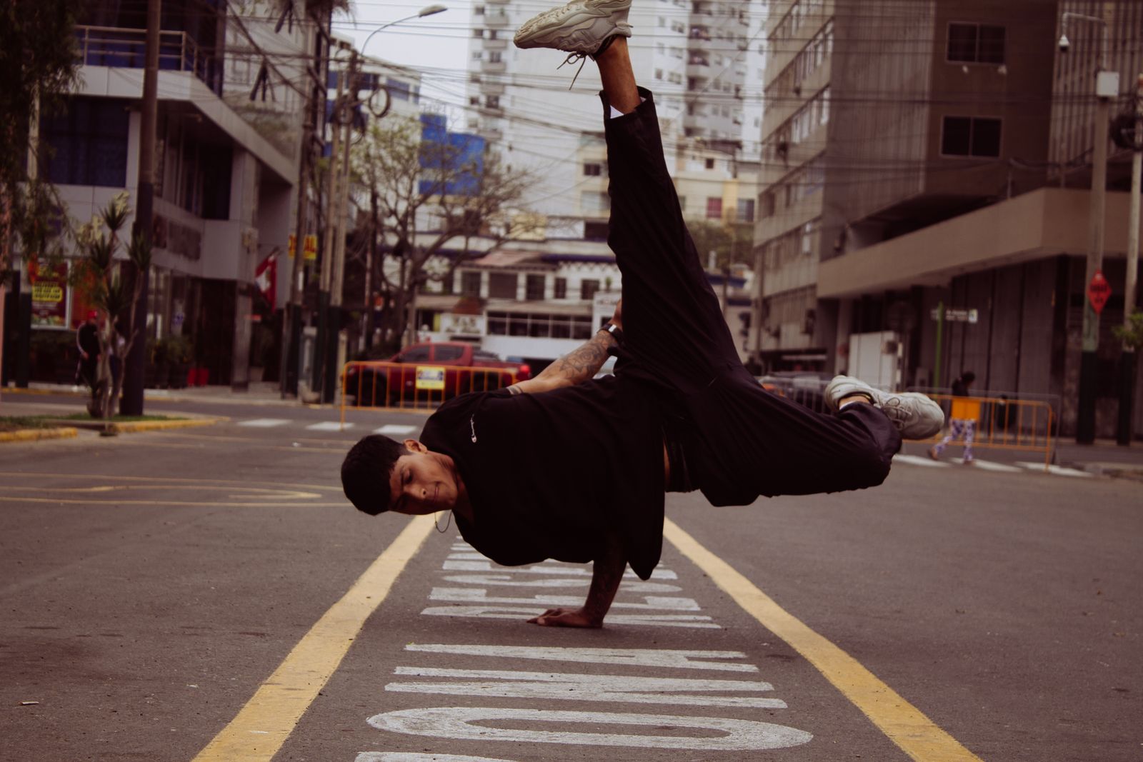 Dancers performing Latin-influenced fitness choreography with expressive arm and hip movement