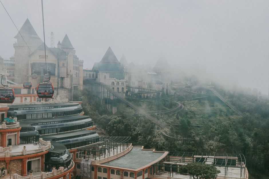 Capture of iconic French village in Ba Na Hills, Vietnam enveloped in mist and viewed from above.