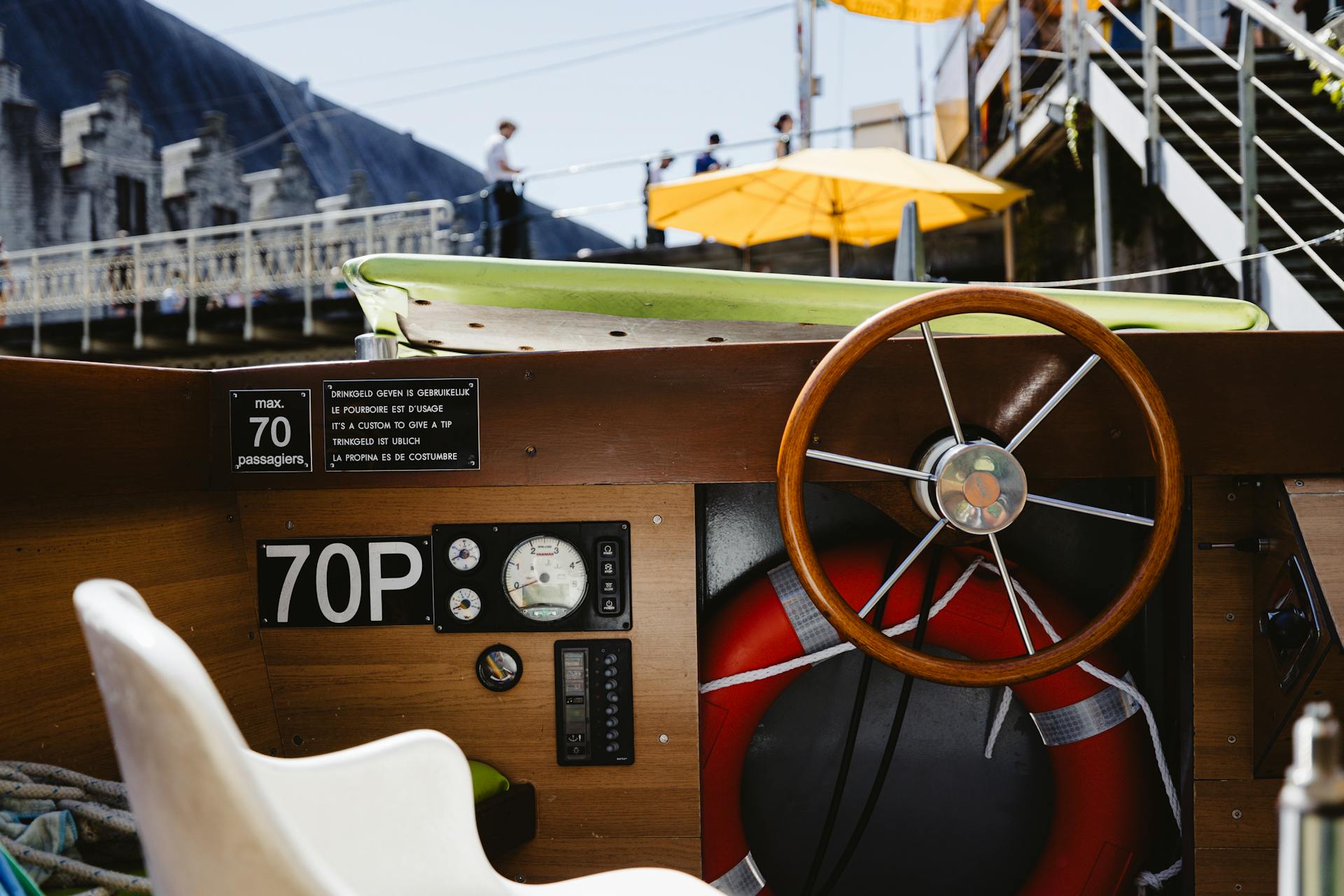 A steering wheel and dashboard on a boat