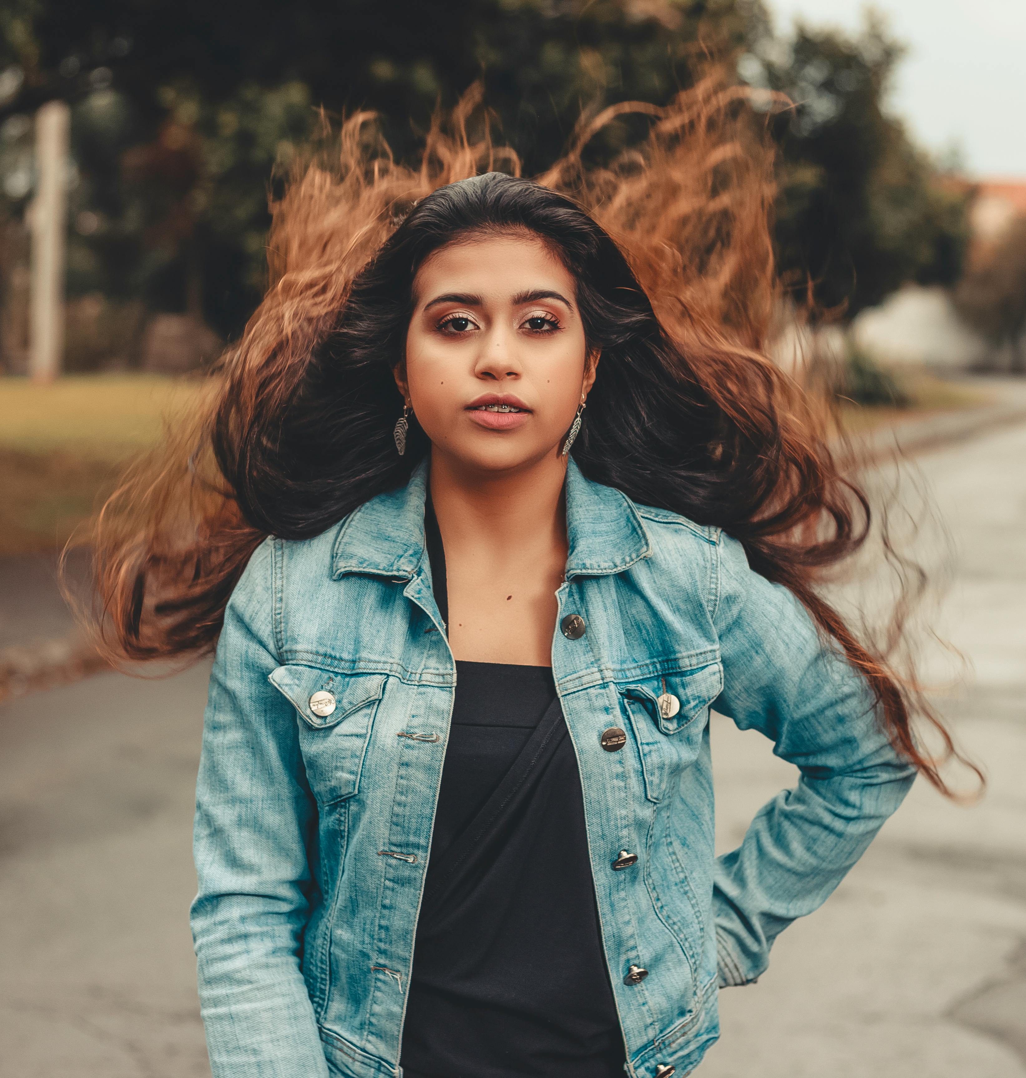 Cute eleven-year-old girl posing in a denim jacket. Stock Photo | Adobe  Stock