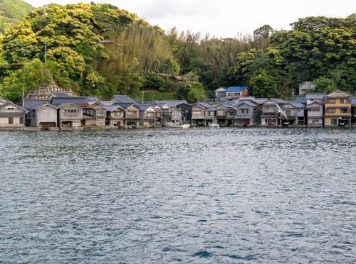 Free Charming waterfront scene of traditional houses in Ine, Kyoto, Japan. A serene travel destination. Stock Photo