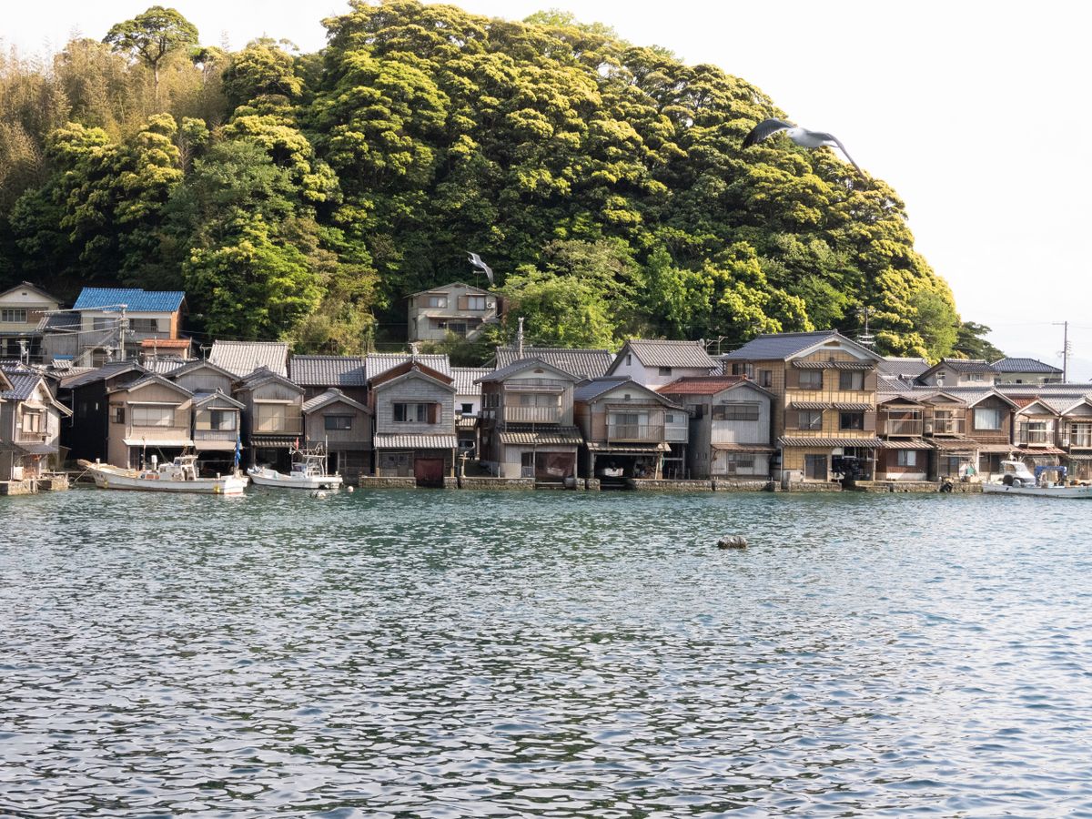 Peaceful Japanese bay with green forested islands in the calm water of northeastern Japan