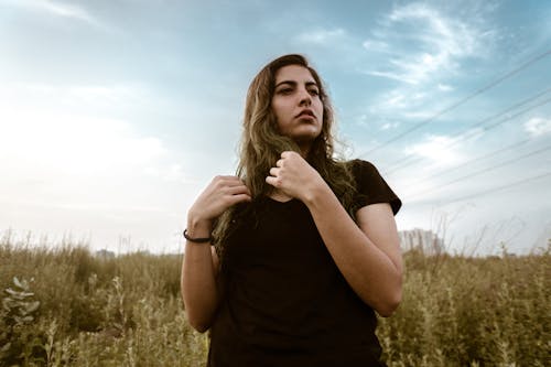 Free Woman Standing Beside Grass Stock Photo