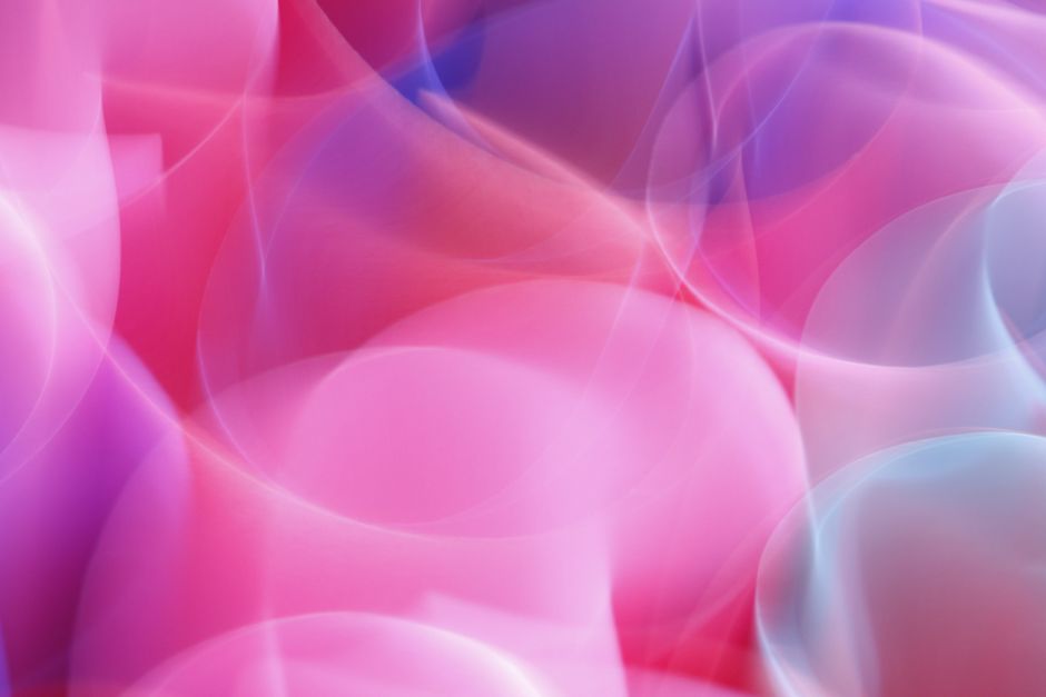 A dynamic and colorful abstract design with smooth gradient waves creating a sense of motion.