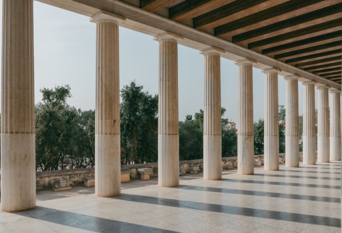Elegant marble columns in Athens showcasing ancient Greek architecture.