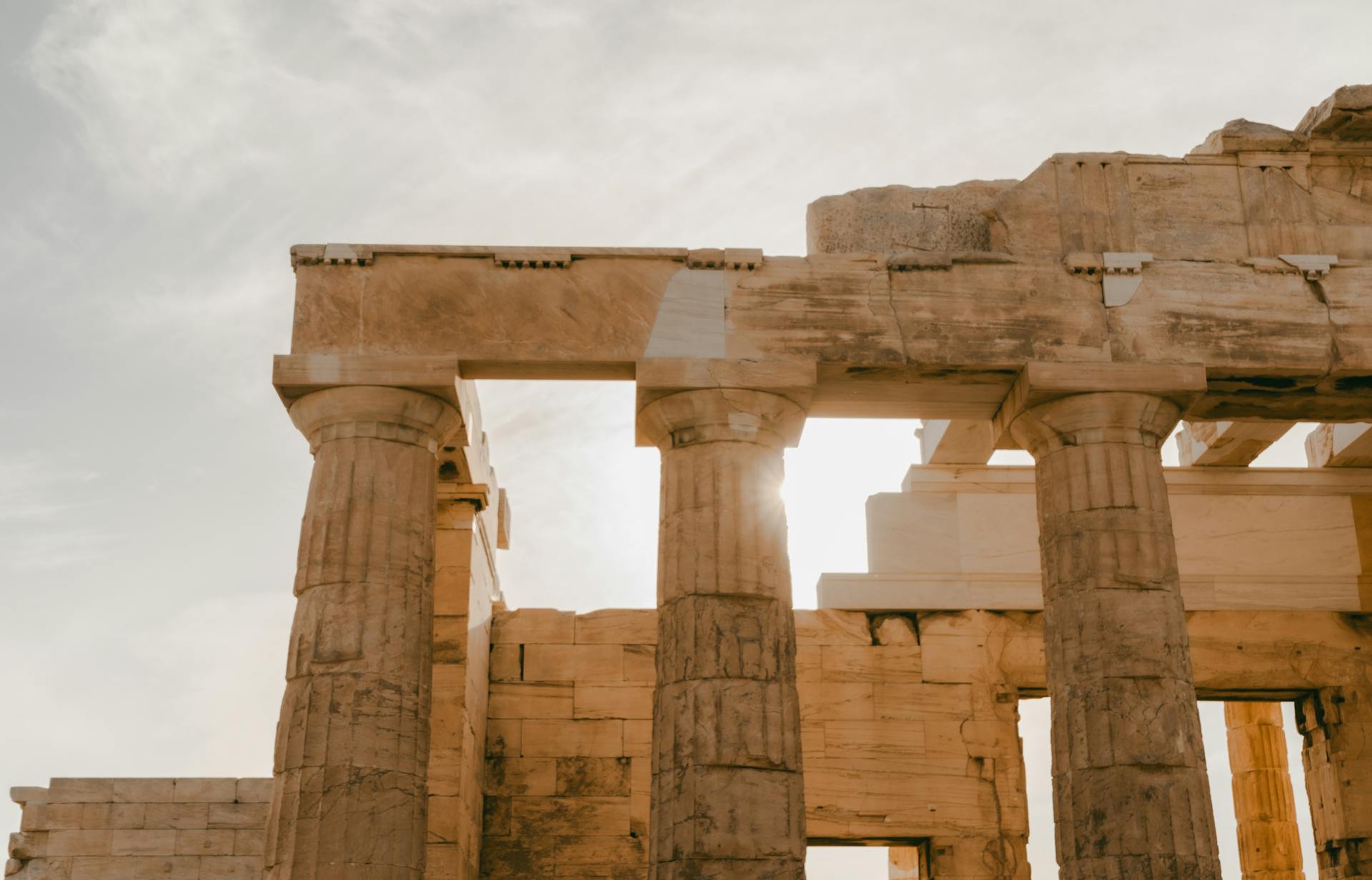 Capture of the historic Parthenon columns with sunlight streaming through in Athens, Greece.