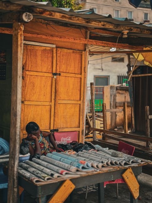 A serene moment captured in a vibrant street scene in Accra, Ghana.