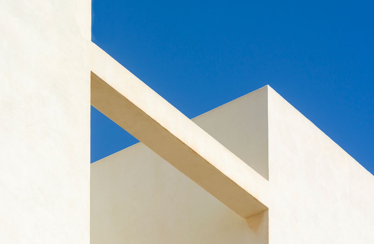 minimalist architectural design showcasing geometric shapes against a