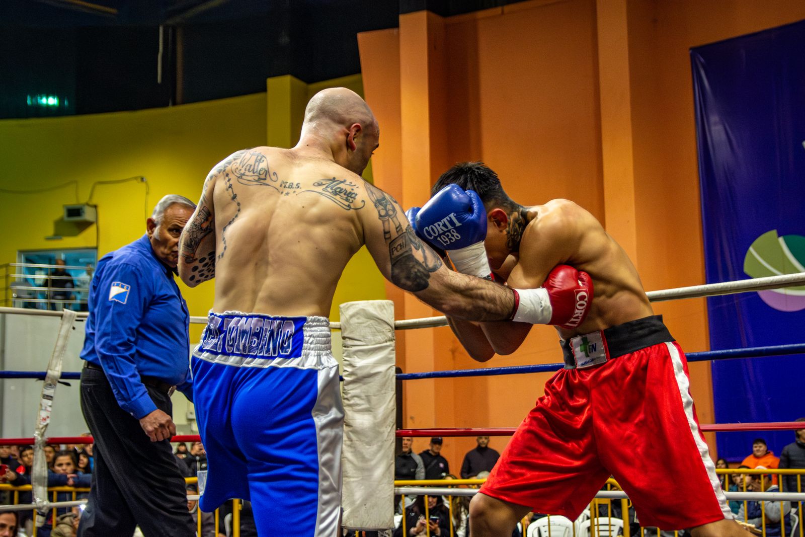 Two men fighting in a boxing ring with one wearing a red shirt · Free ...