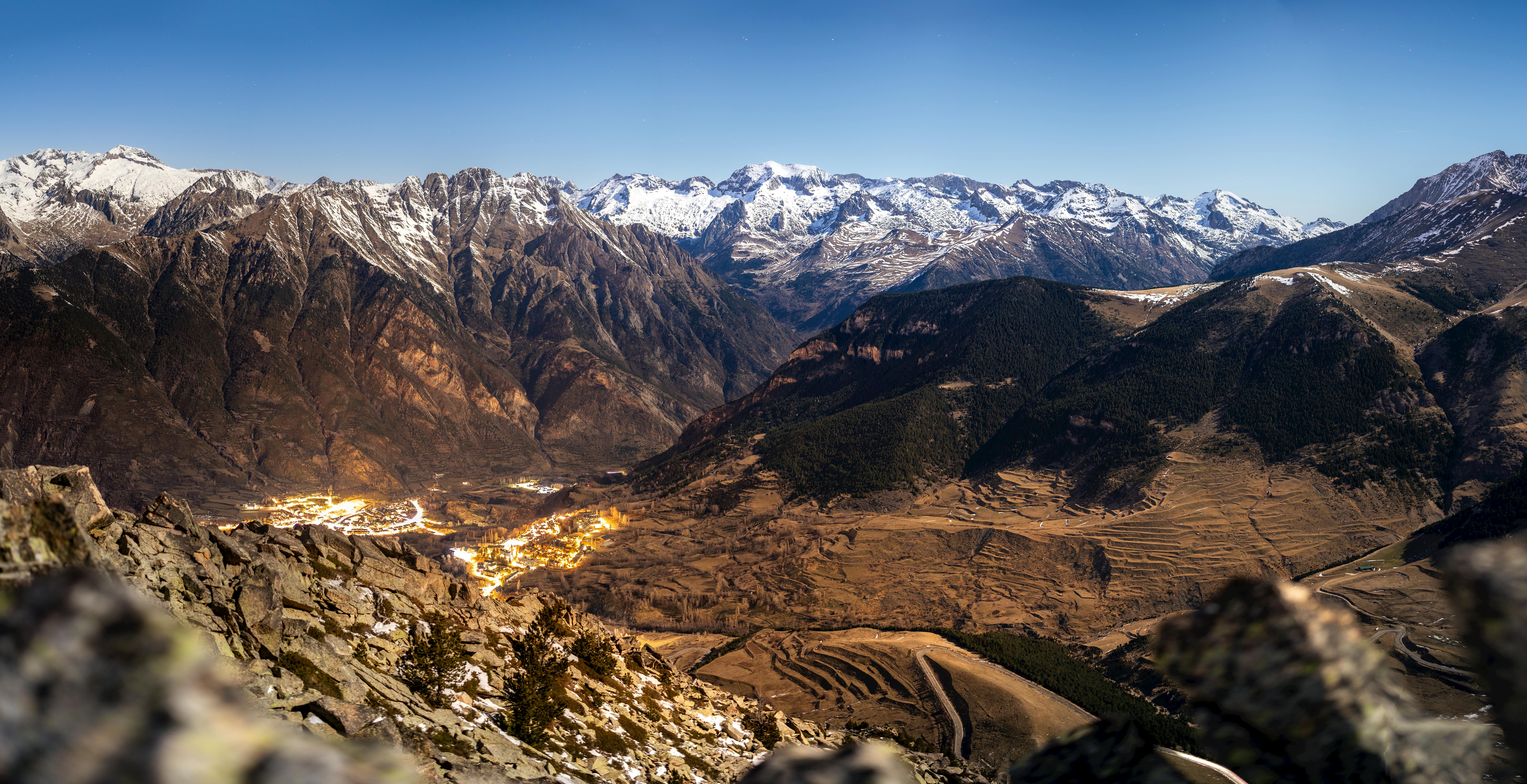 a view of a mountain range with snow capped peaks