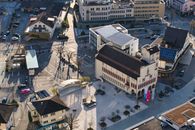 A detailed aerial capture of a city's urban landscape and architectural designs.