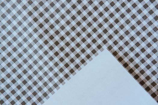 High-quality close-up of a seamless brown gingham fabric pattern creating a textured, geometric design.