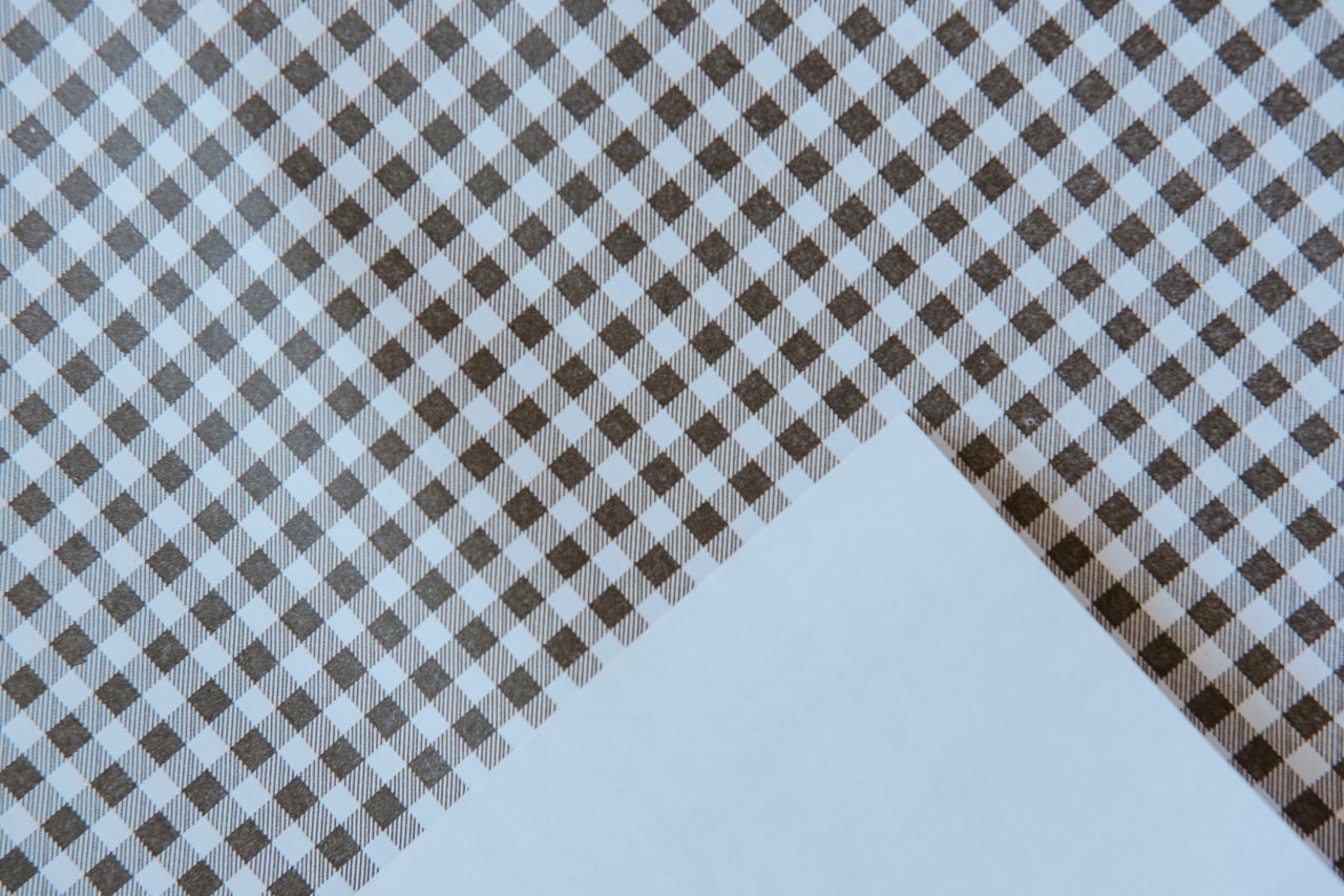 high quality close up of a seamless brown gingham fabric pattern creat