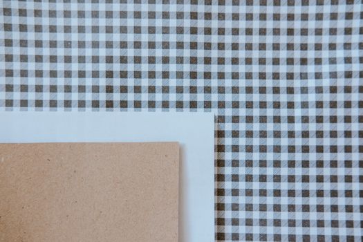 Stylish patterned fabric and paper layout highlighting minimalist geometric design.
