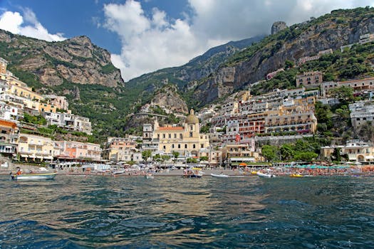 Captivating view of Positano's vibrant coastline nestled in the mountains of Italy.
