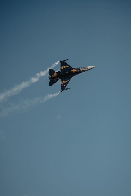 Free F-16 jet performing aerobatics in clear blue sky during airshow in Istanbul. Stock Photo