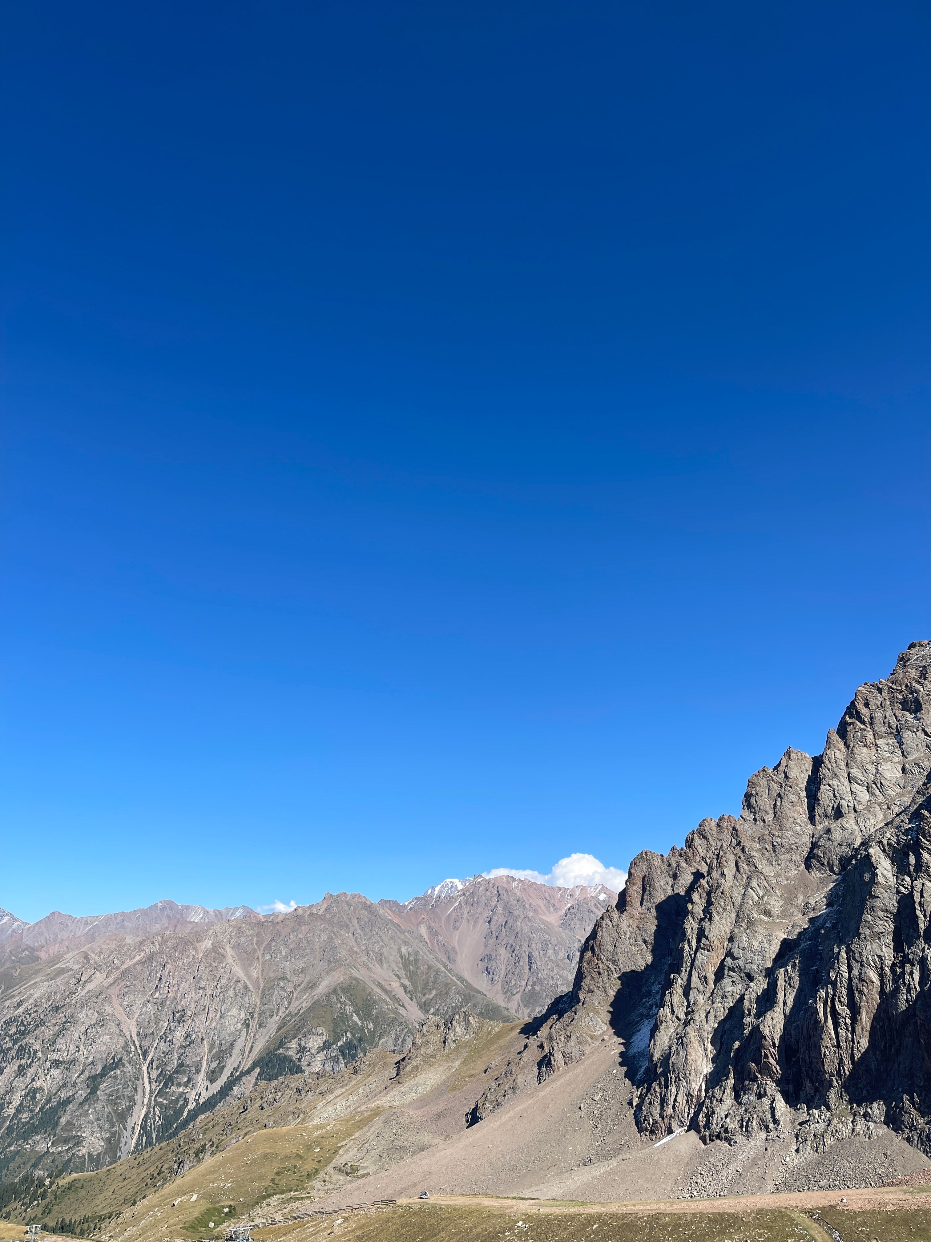 Dramatic Peaks under Clear Blue Sky in Kazakhstan · Free Stock Photo