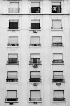 Vertical shot of a residential building facade in Buenos Aires, Argentina, emphasizing urban architecture.