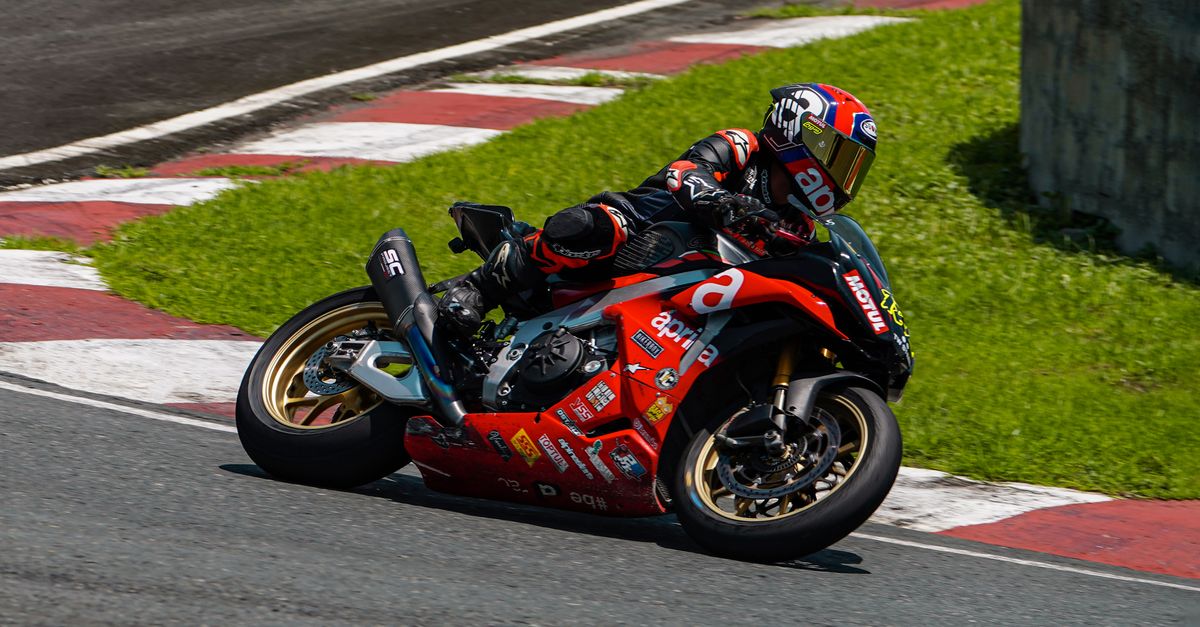 Motorbikes Riding Track A person riding a motorcycle on a track · Free Stock Photo