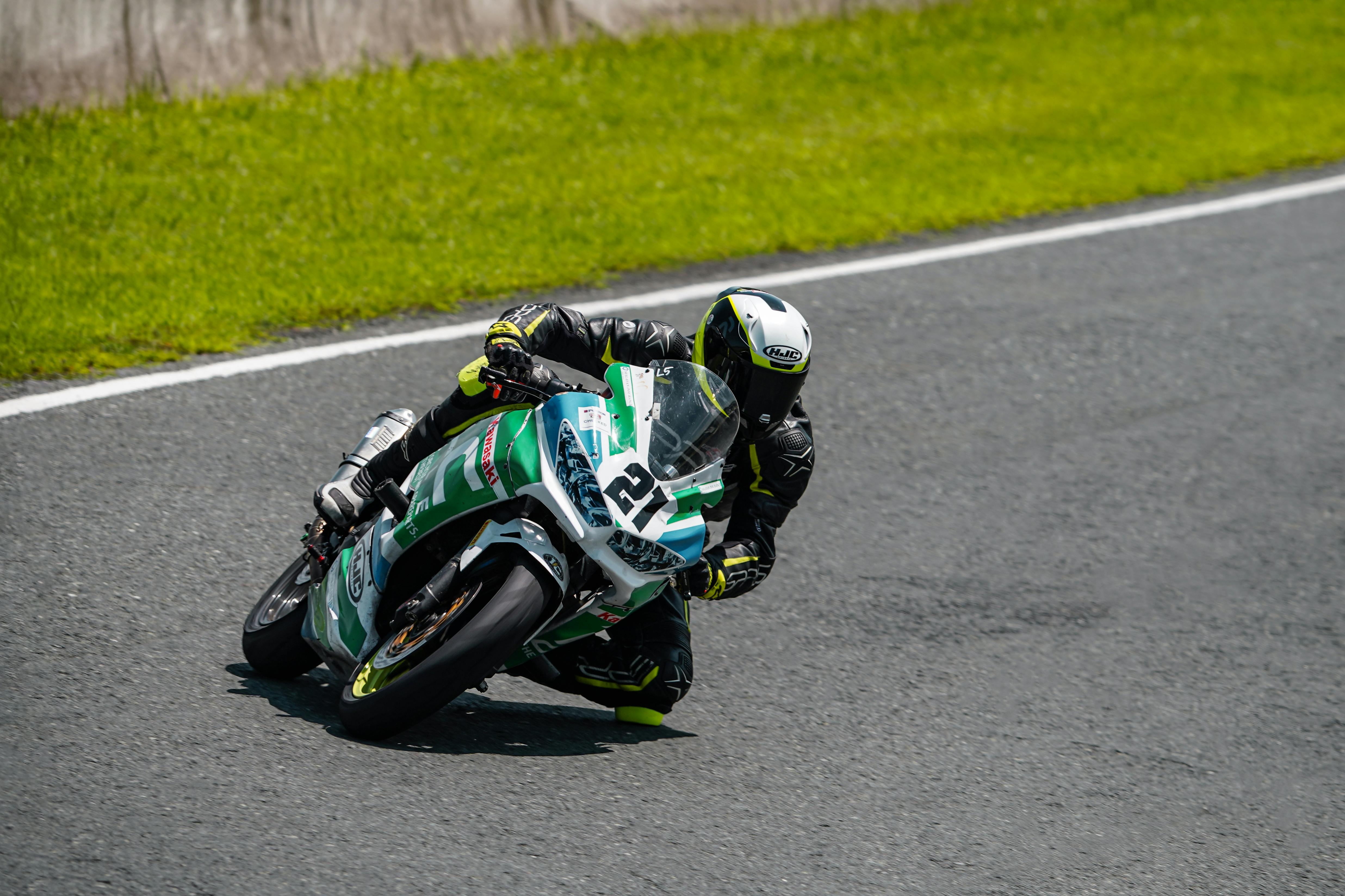 a person riding a motorcycle on a race track