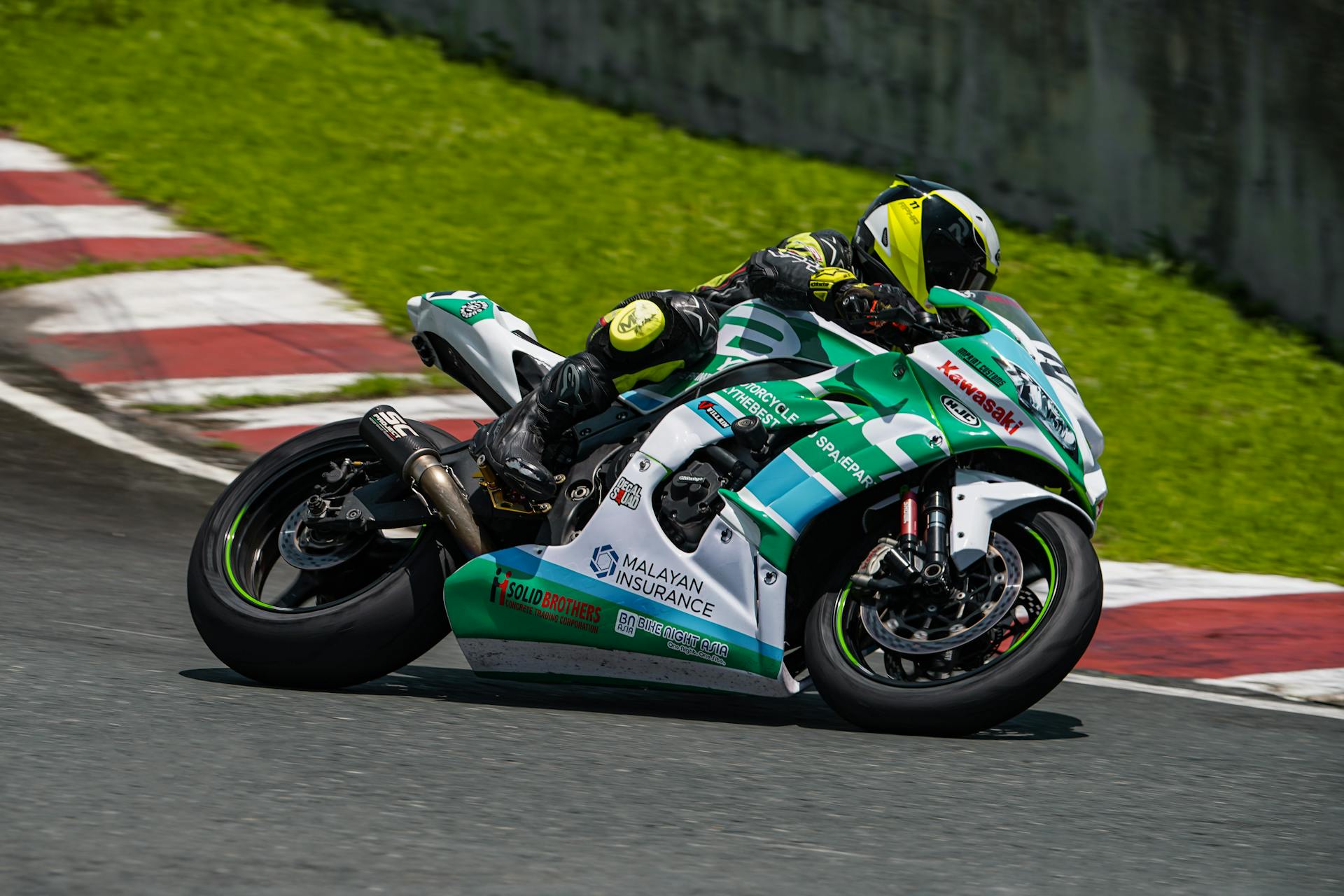 Motorcycle racer in action during a thrilling race on the Batangas circuit in the Philippines.