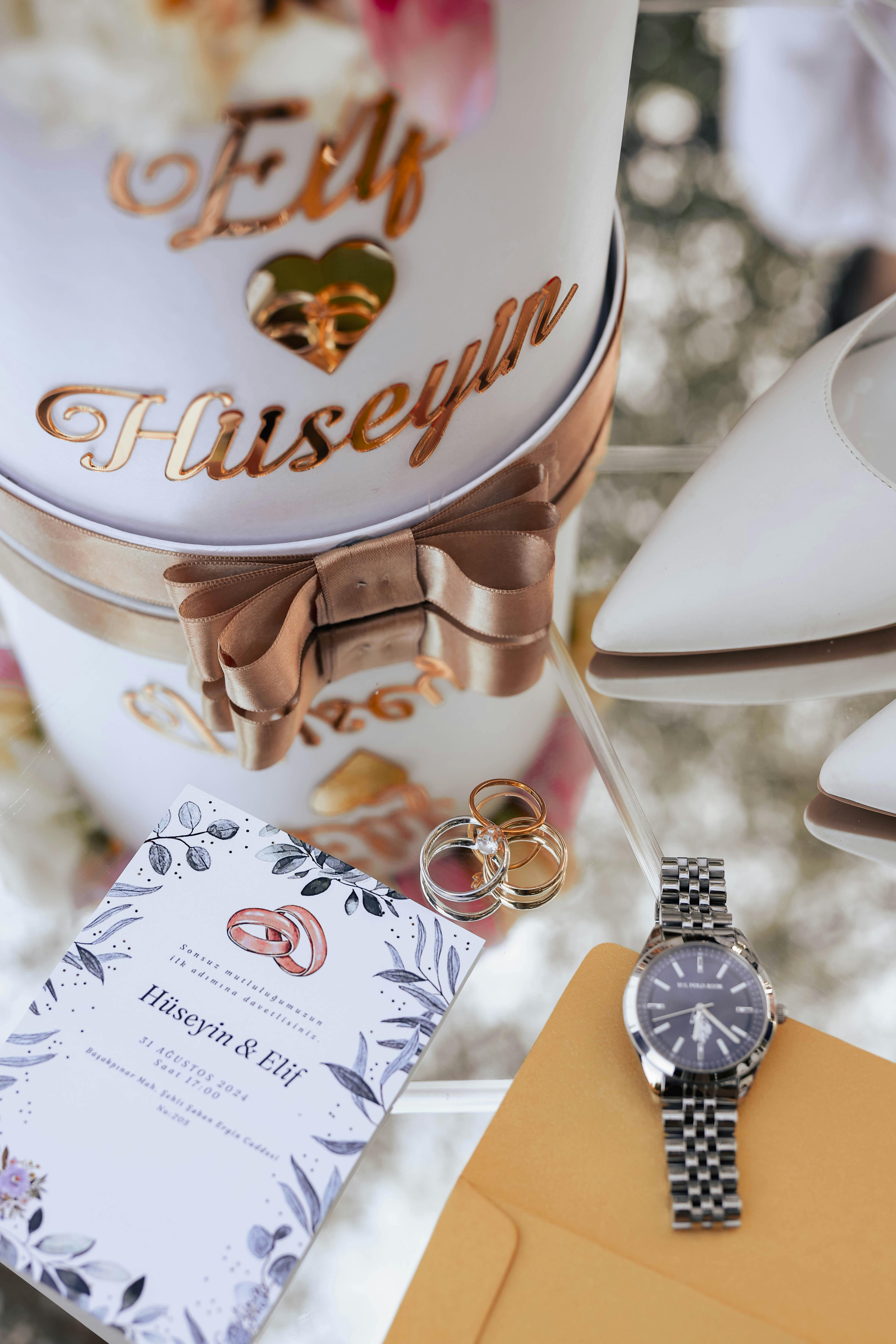 a wedding gift box with a watch and flowers