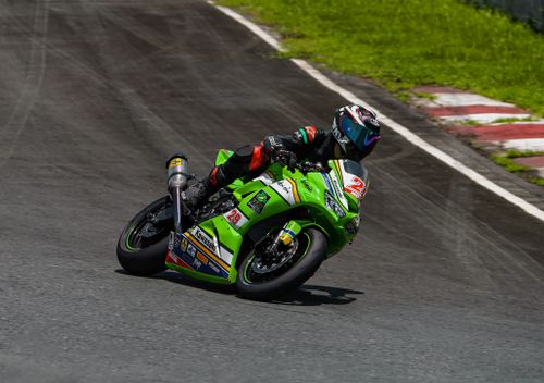 Free Dynamic image of a motorcycle racer speeding on the track in Batangas, Philippines. Stock Photo