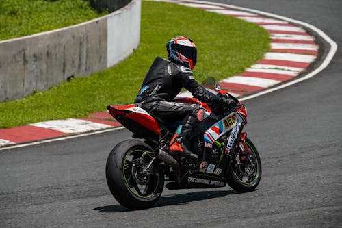 Rider's Riding on Gray and Black Sports Bike · Free Stock Photo