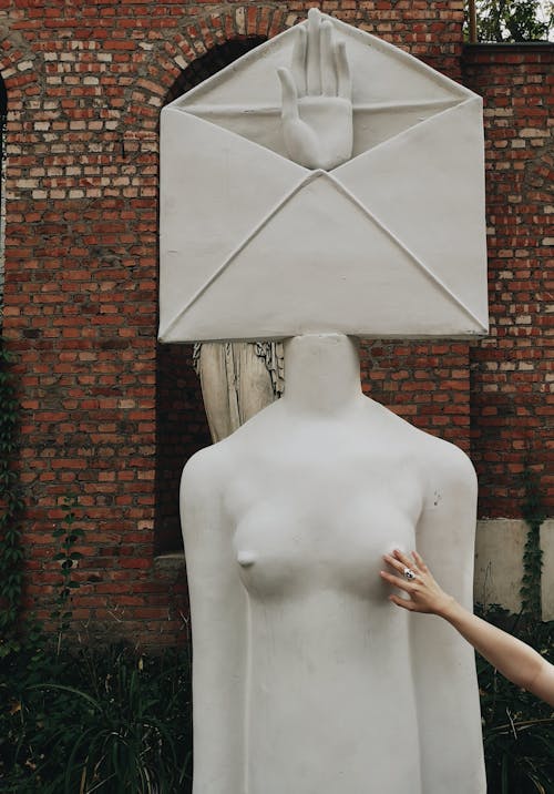 Person Touching An Artistic Sculpture