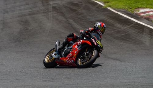 Free Motorcycle racer taking a sharp turn on a racing circuit in Batangas, Philippines. Stock Photo