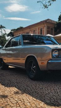 Vintage sedan parked outdoors on a sunny day in Barra Bonita, Brazil capturing nostalgic automotive charm.