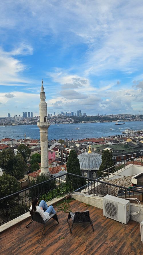 Free A breathtaking view of the Bosphorus Strait and an Istanbul mosque from a rooftop terrace. Stock Photo