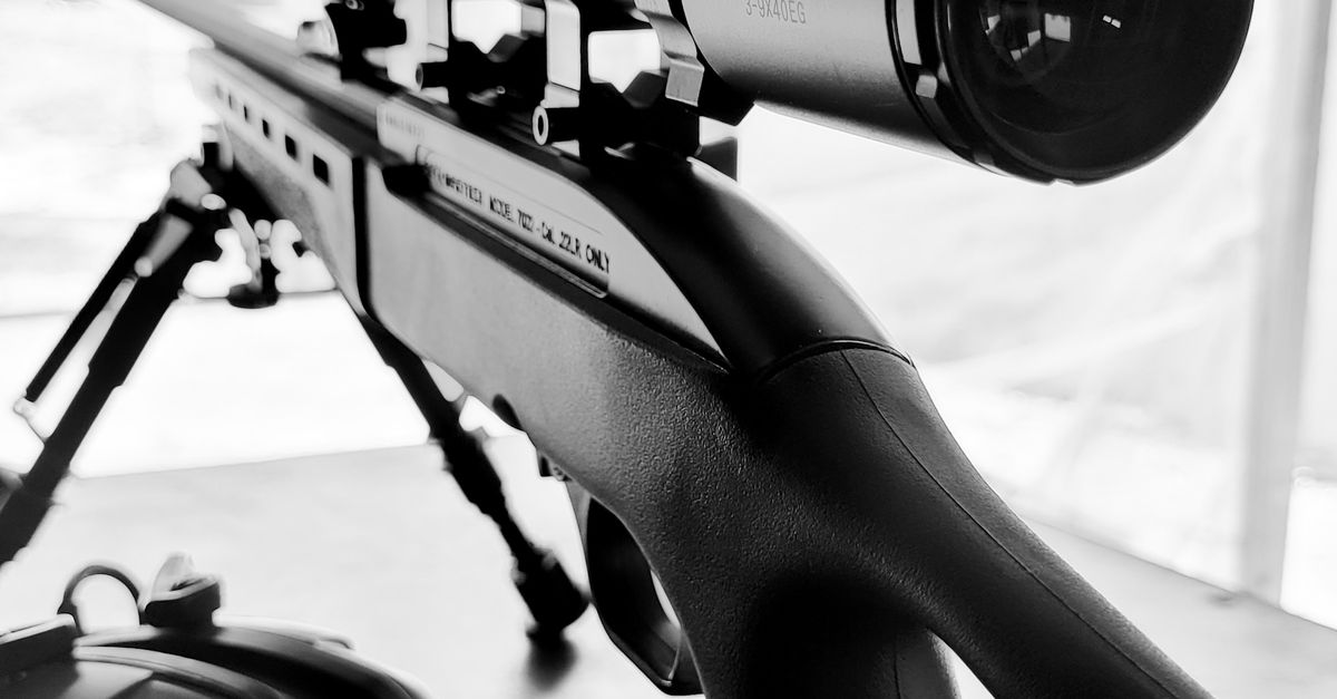 Photographic Rifle A rifle with a scope and a camera on it · Free Stock Photo